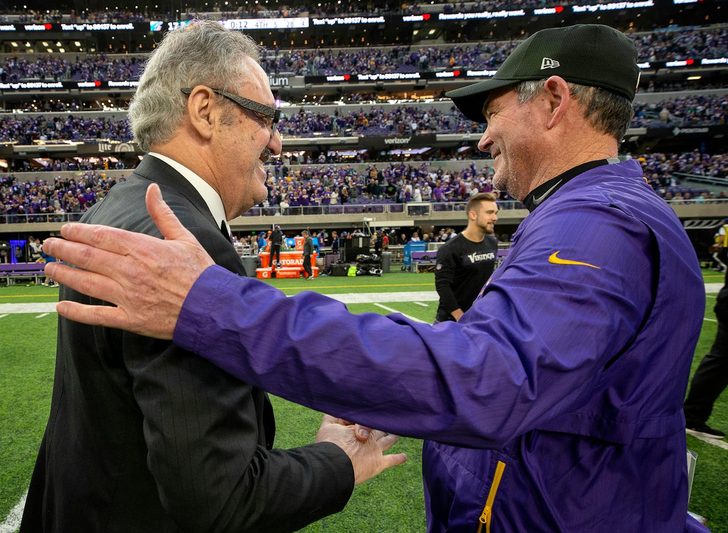 Vikings owner Zygi Wilf greets head coach Mike Zimmer at the end of the game against the Dolphins on Sunday. Wilf said there is no question about who will be leading the franchise next season.