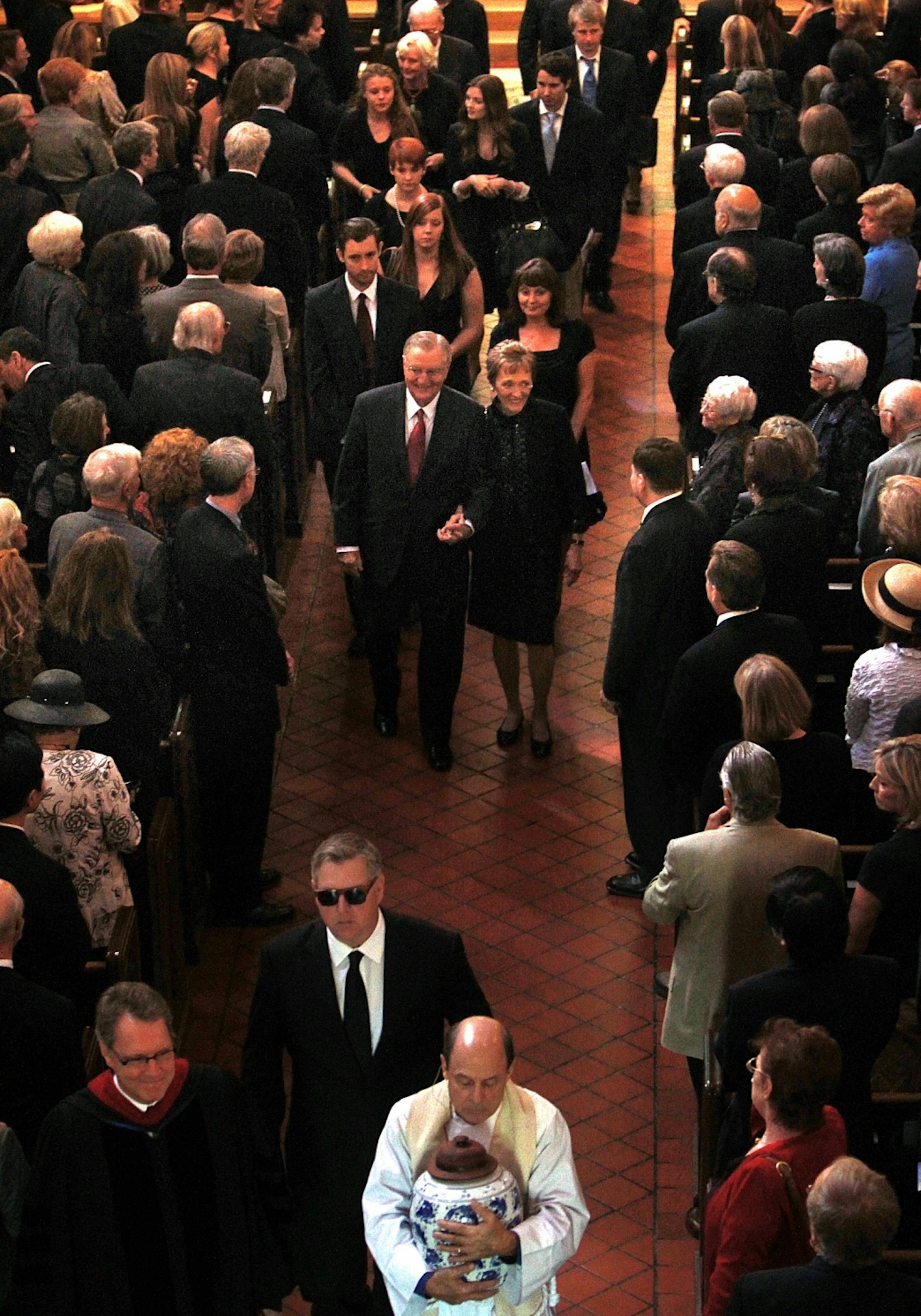 Rev. Spenser D. Simrill carried the remains of Eleanor Mondale Poling from the church after the service. He was joined by family members, including Chan Poling (Eleamor's husband-behind, left) and parents, former vice president Walter Mondale and Joan Mondale.