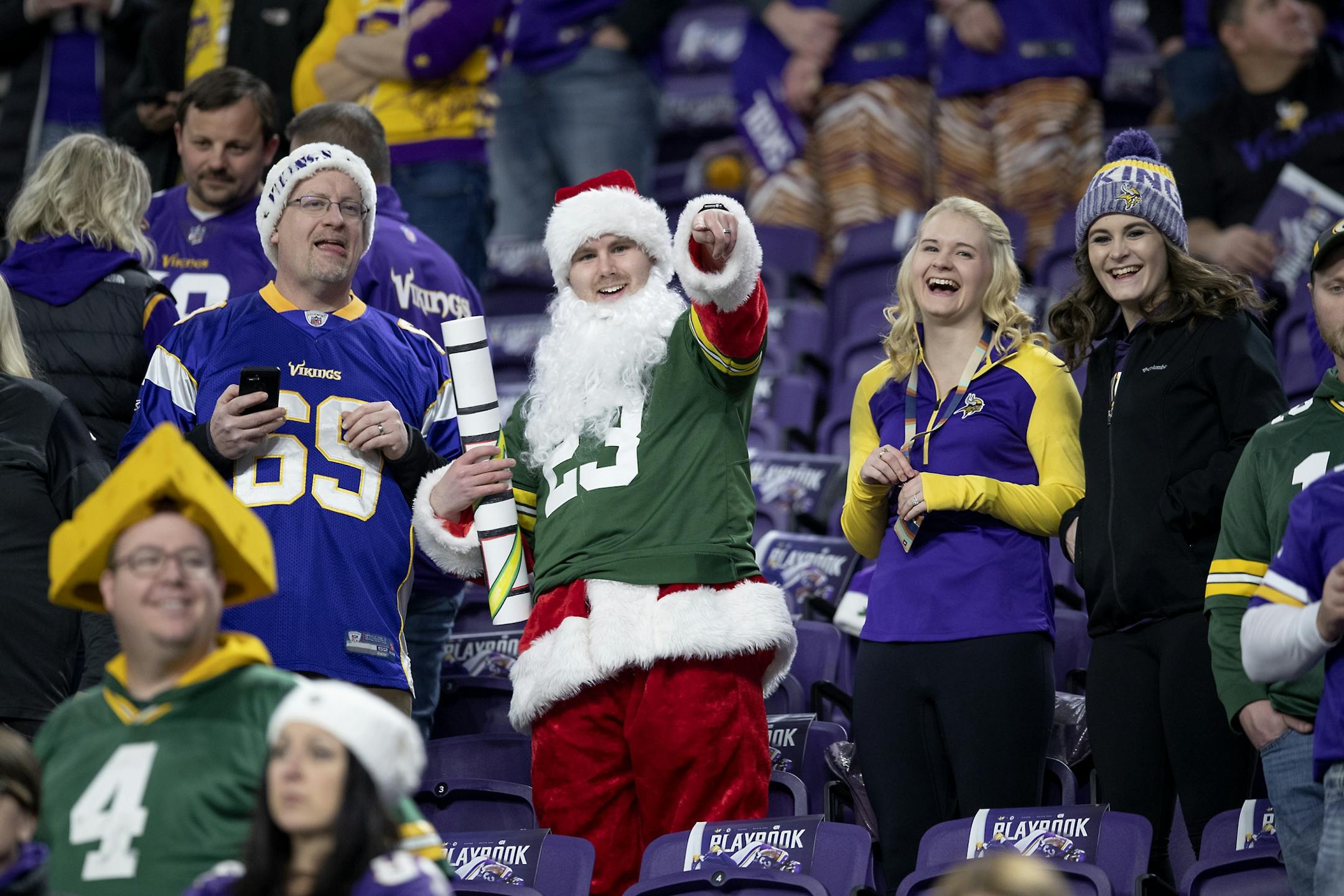 Vikings and Packers fans cheered on their favorite players as they made their way onto the field during pre-game warm-ups.