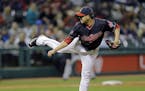 Cleveland Indians' Anthony Swarzak follows through on a pitch against the Chicago White Sox in the sixth inning of a baseball game Tuesday, April 14, 