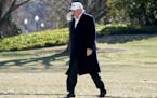 President Donald Trump walks across the South Lawn as he arrives at the White House in Washington, Sunday, Jan. 7, 2018, after traveling from Camp Dav