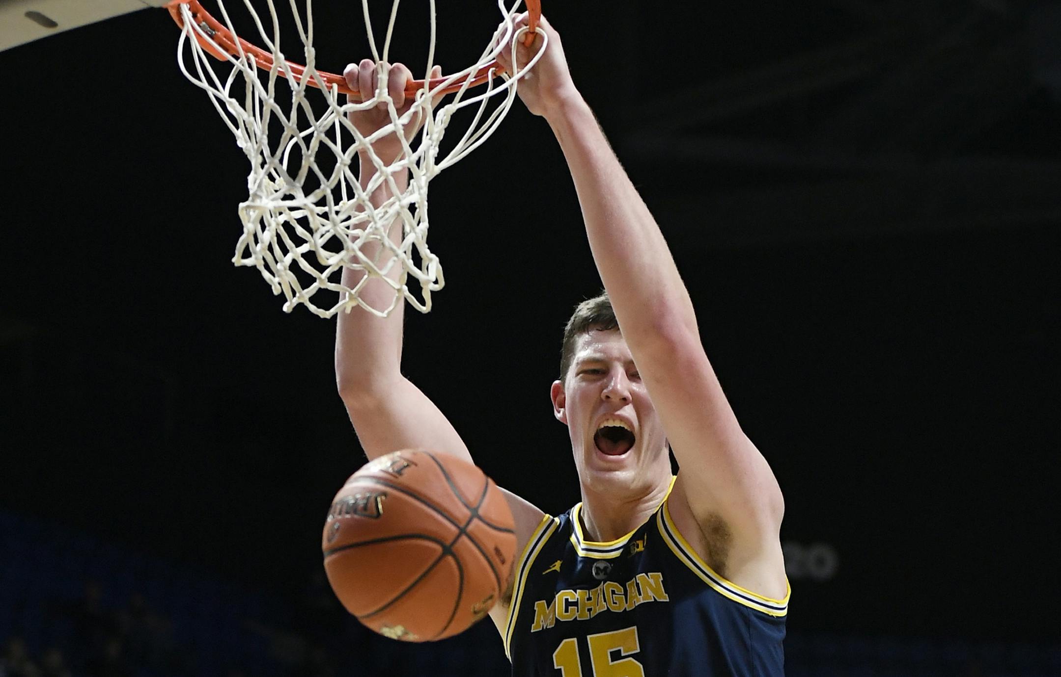 Michigan's Jon Teske (15) dunks the ball during the second half of an NCAA college basketball game against Providence, Sunday, Nov. 18, 2018, in Uncasville, Conn. (AP Photo/Jessica Hill)