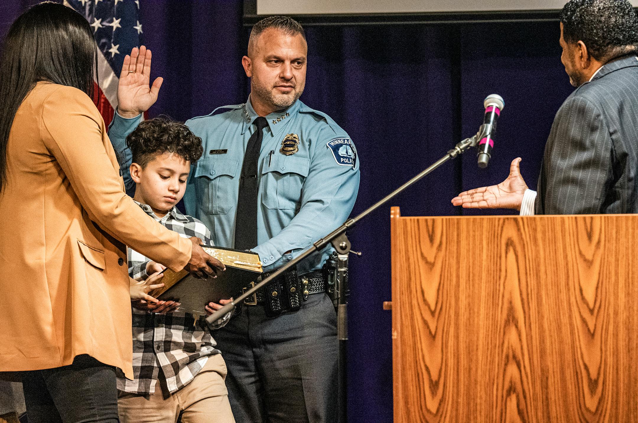 Bishop Howell Jr. presides as Brian O'Hara is sworn in as the new Minneapolis Chief of Police, surrounded by wife Wafiyyah O'Hara and son Brendan at Shiloh Temple in Minneapolis, Minn., on Thursday, Nov. 10, 2022. Community leaders formally welcomed O'Hara and his family to town with pomp and circumstance, including performances by the color guard.