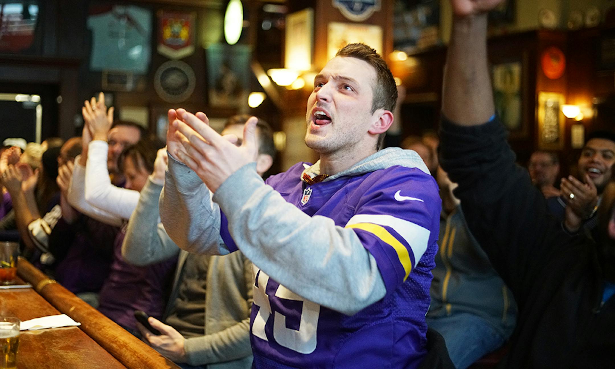 Braden Eichten of St. Paul cheered on the Vikings as they scored a touchdown. ]Vikings fans watch their team take on the Cleveland Browns on the televisions at Brit's Pub.Richard Tsong-Taatarii/Richard.tsong-taatarii@startribune.com