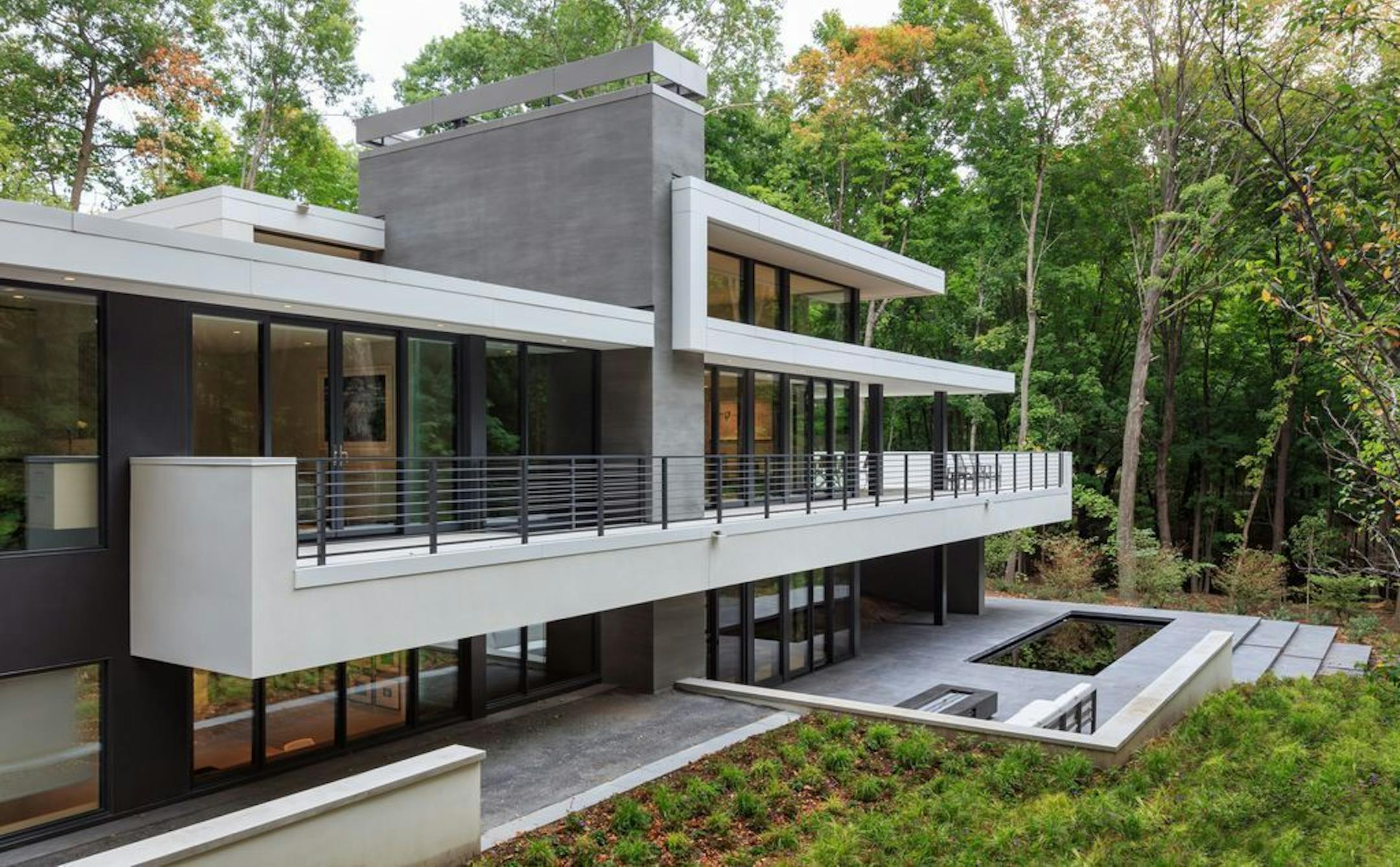 The deck overlooks a reflecting pool.
