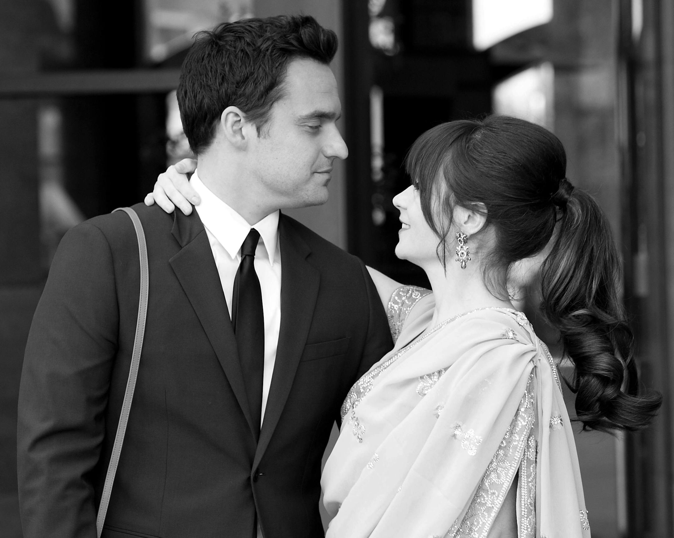 NEW GIRL: Jess (Zooey Deschanel, R) and Nick (Jake Johnson, L) celebrate at Cece's wedding in the "Elaine's Big Day" season finale episode of NEW GIRL airing Tuesday, May 14 (9:00-9:30 PM ET/PT) on FOX. ©2013 Fox Broadcasting Co. Cr: Jennifer Clasen/FOX