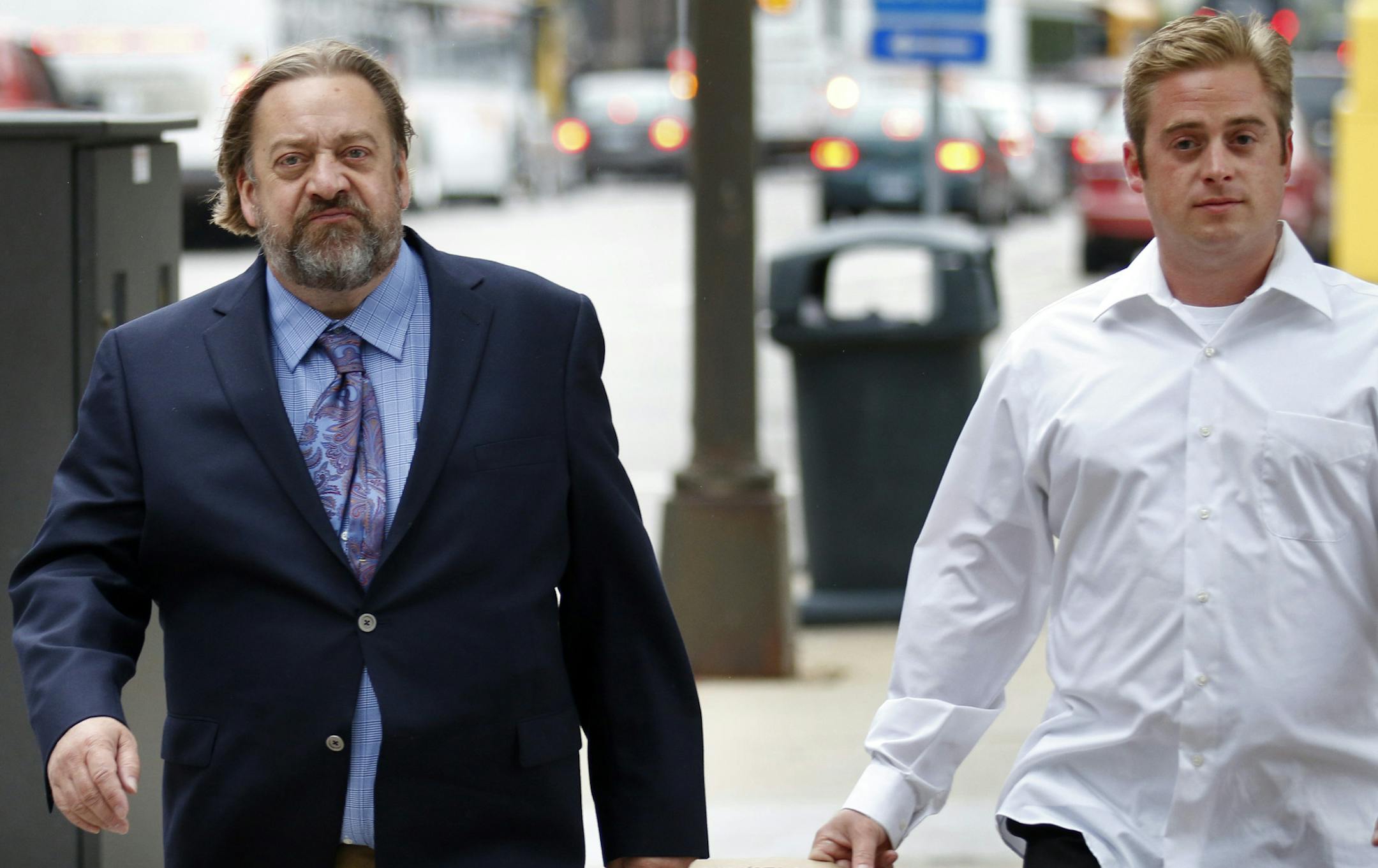 Jim Carlson (left), owner of Last Place on Earth, faces 54 counts of violating federal drug and regulatory laws. Opening arguments Tuesday afternoon in the federal trial the Duluth head shop owner and two workers including Carlson's son Joseph Gellerman (right). Here, Carlson and Gellerman walk downtown Minneapolis after court Wednesday afternoon.] BRIAN PETERSON ‚Ä¢ brianp@startribune.com Minneapolis, MN - 09/17//2013