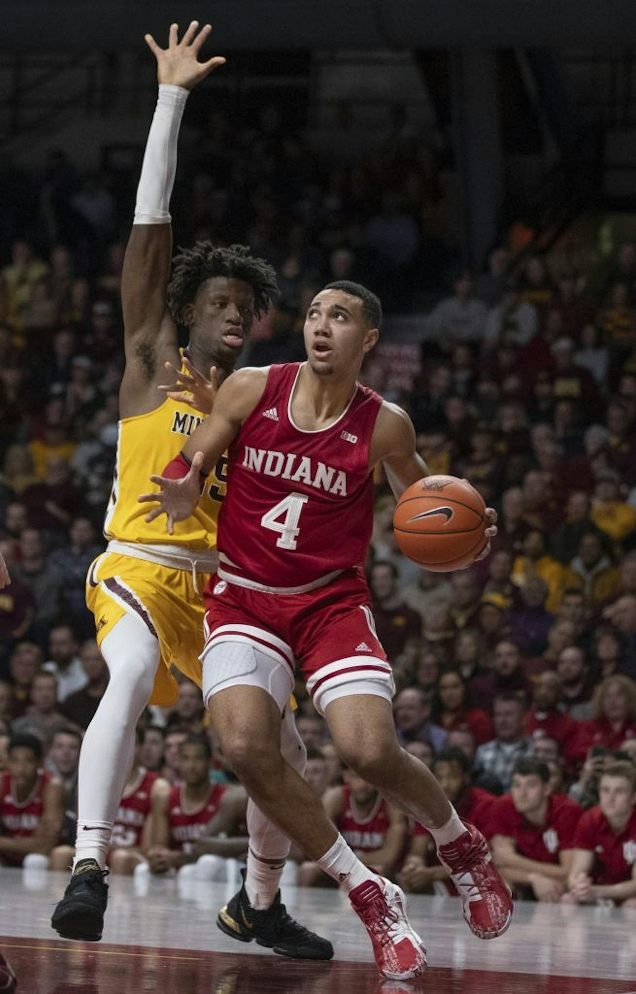 Indiana Hoosiers forward Trayce Jackson-Davis (4) drove to the basket on Minnesota Gophers center Daniel Oturu (25) in the second half .