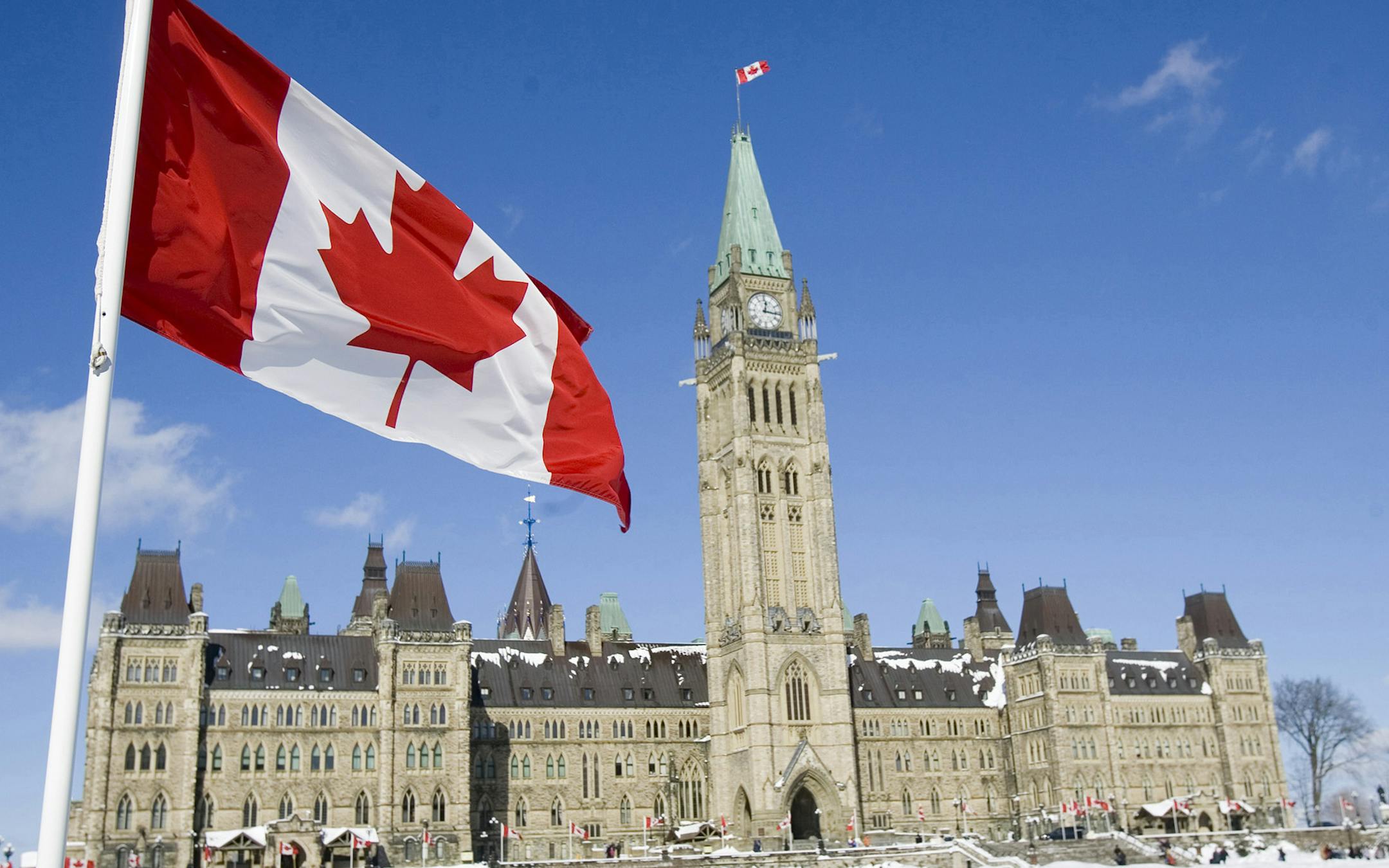 A Canadian Flag flies over Parliament Hill in Ottawa Friday, Feb. 15, 2008. It is the 43rd anniversary of the creation of the Canadian flag. (AP Photo/The Canadian Press, Tom Hanson) ORG XMIT: OTTH101
