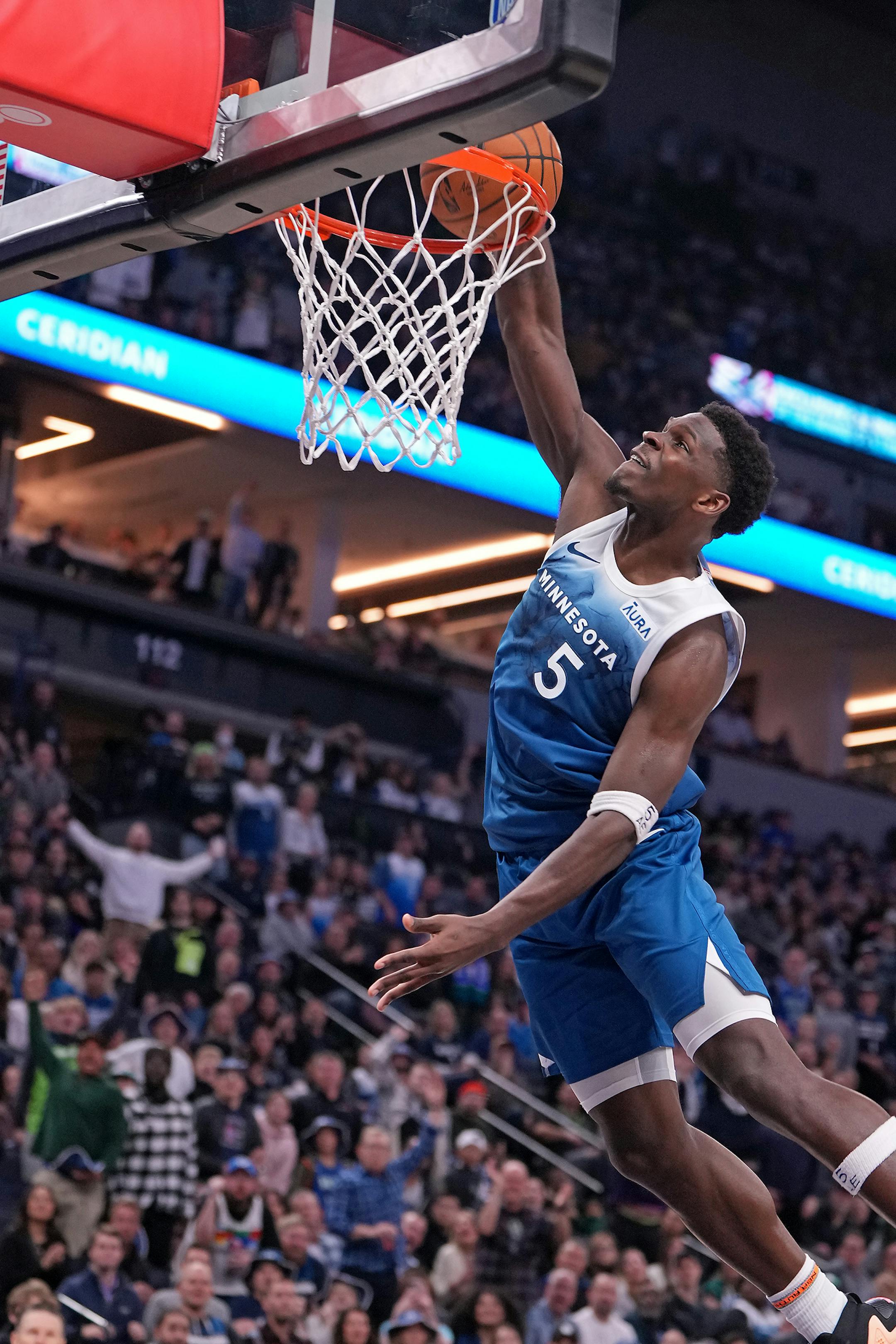 Minnesota Timberwolves guard Anthony Edwards (5) dunks during the second half of the game.