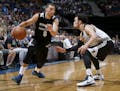 Zach LaVine (8) was defended by Tyus Jones (1) during a team scrimmage at Target Center.