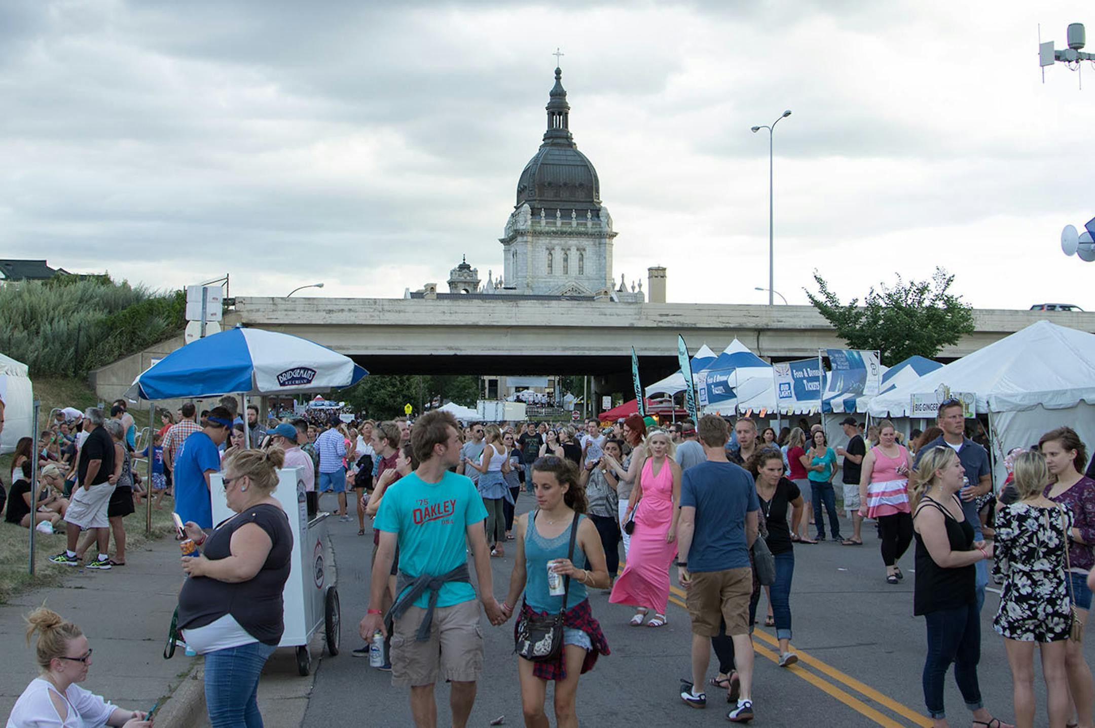 Attendees walk to the Great Clips stage to watch American Authors perform on day one of the 2016 Basilica Block Party on July 8, 2016 at the Basilica in Minneapolis, Minn. [ Special to Star Tribune, photo by Matt Blewett, matt@mattebphoto.com, Basilica Block Party 2016, 550335 BASILICA070916