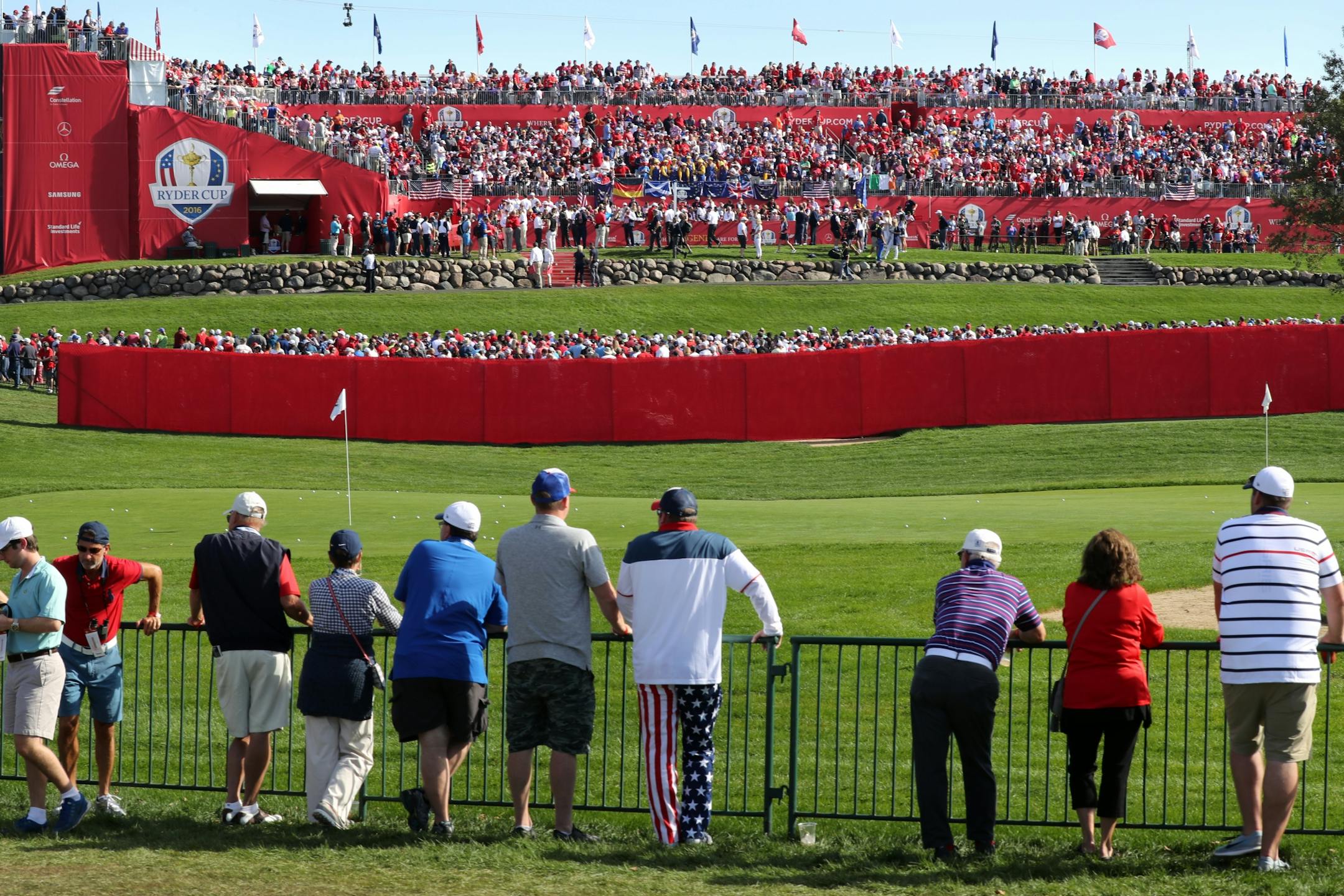 Fans packed the stands and filled in along the fringes for the first tee of the final day of the 2016 Ryder Cup.