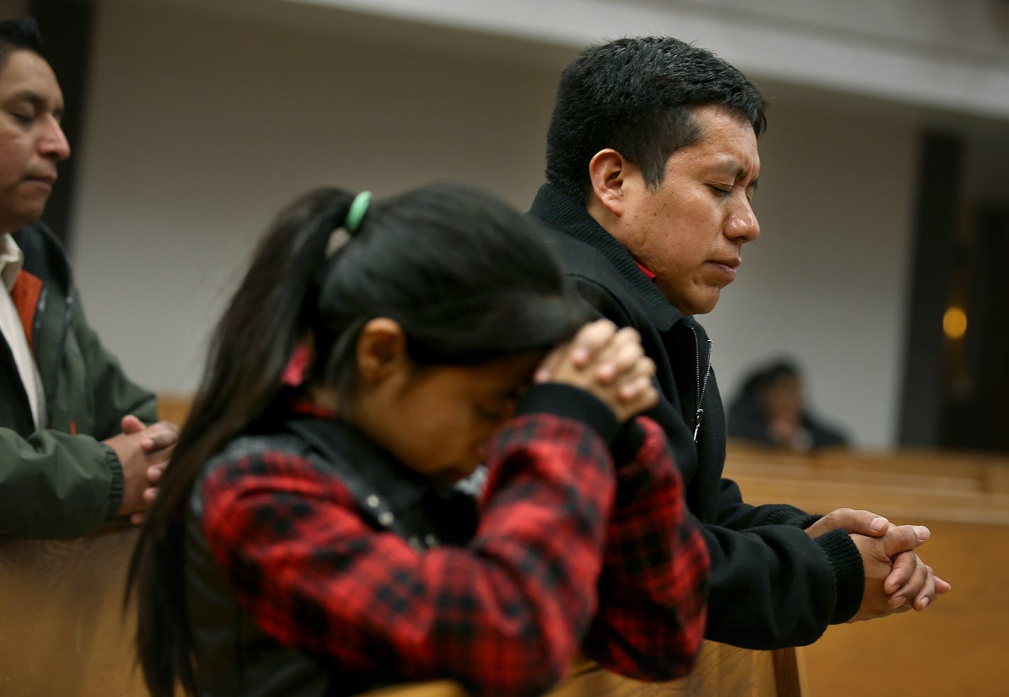 Jacobo Gabriel-Tomas said that his church St. Mary's Catholic Church, has been a great support system , as he prayed with his daughter Beatriz, Tuesday, December 09, 2014 in Worthington, MN. ] (ELIZABETH FLORES/STAR TRIBUNE) ELIZABETH FLORES &#x2022; eflores@startribune.com