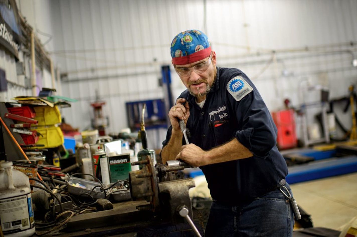 Tim Nelson worked in the Hastings auto repair shop he runs with his wife Kristi.