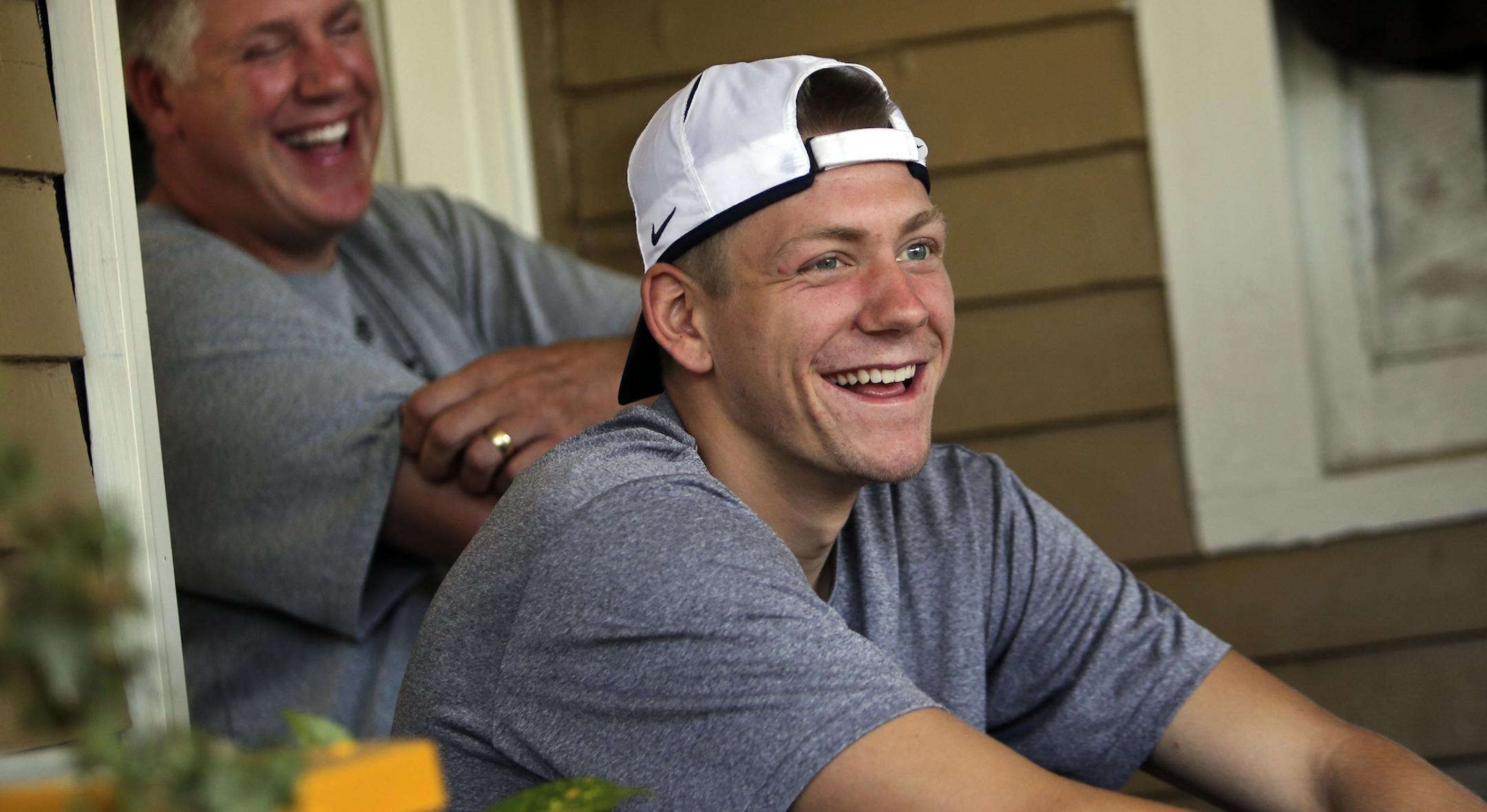 Both Wally Ellenson, front, and his father John were two-sports stars in high school. John in basketball and track at Wisconsin schools Menomonie High in the mid-80s and Wally at Rice Lake High in 2012.