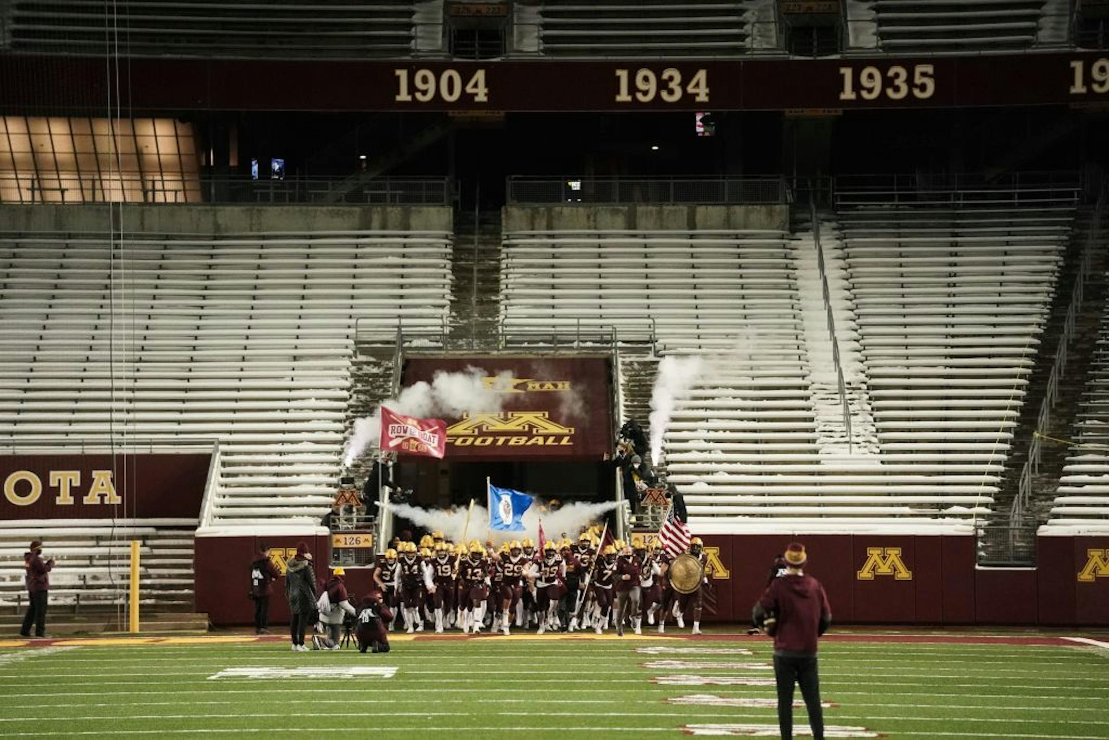The Minnesota Gophers took the field to nearly empty stands.
