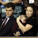 Bristol Palin, daughter of Republican Vice President candidate Sarah Palin, holds her baby brother, Trig, as her husband-to-be Levi Johnston looks on,