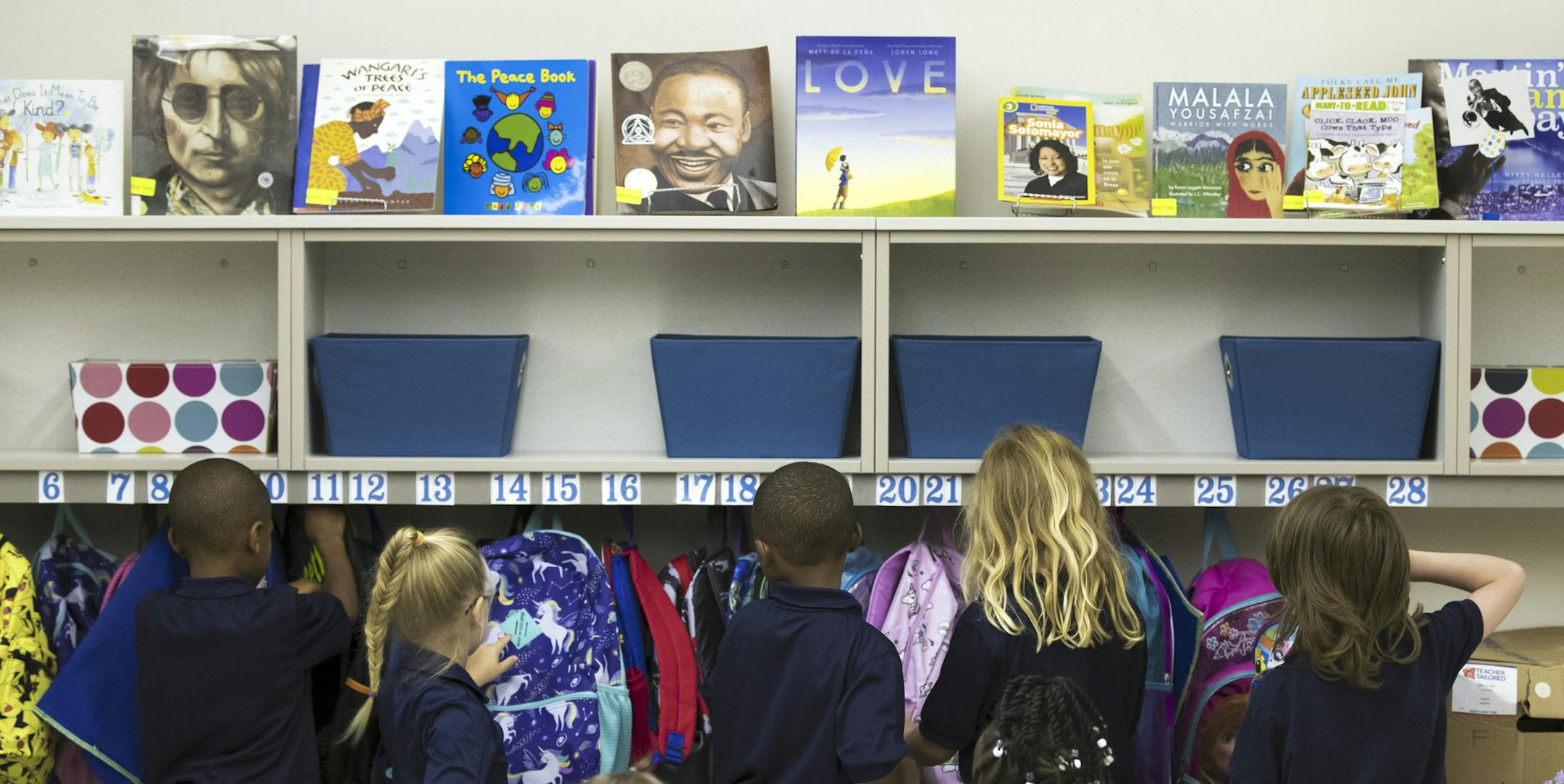 In this Monday, Aug. 5, 2019, photo students hang their backpacks before the start of the first day of school at Morris Jeff Community School in New Orleans, La. (David Grunfeld/The Advocate via AP)