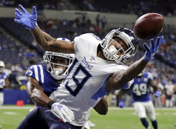 FILE - In this Nov. 18, 2018, file photo, Tennessee Titans' Tajae Sharpe (19) makes a touchdown catch against Indianapolis Colts' Kenny Moore during t