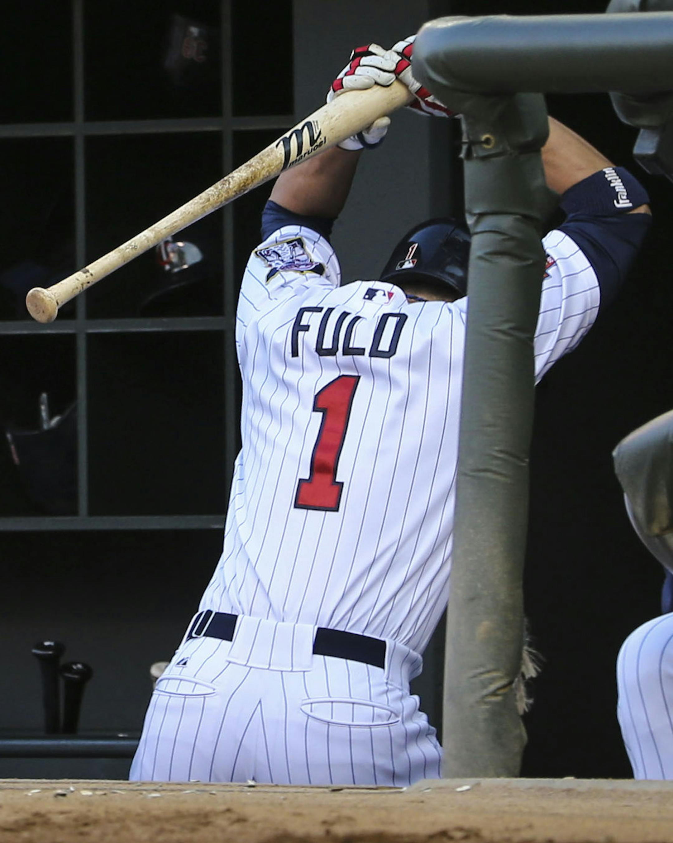 Twins' Sam Fuld threw his bat down in the dugout after striking out with three on base and one out in the second inning of the Minnesota Twins verse the Cleveland Indian game on Tuesday, July 22, 2014, at Target Field in Minneapolis, Minn. ] RENEE JONES SCHNEIDER • reneejones@startribune.com