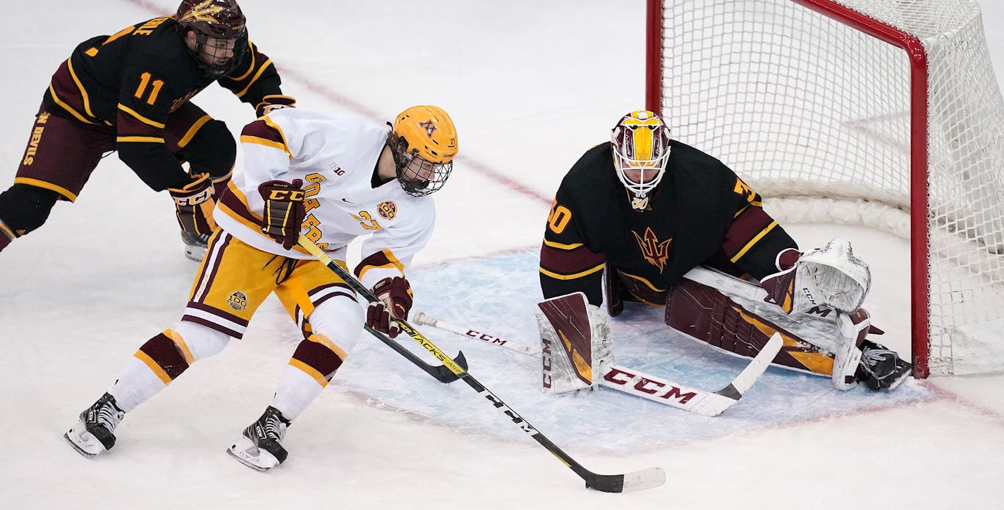 Minnesota forward Blake McLaughlin (27) took the puck in for a shot on Arizona goaltender Evan Debrouwer (30) as Arizona forward Benji Eckerle (11) defended in the third period. ] ANTHONY SOUFFLE • anthony.souffle@startribune.com