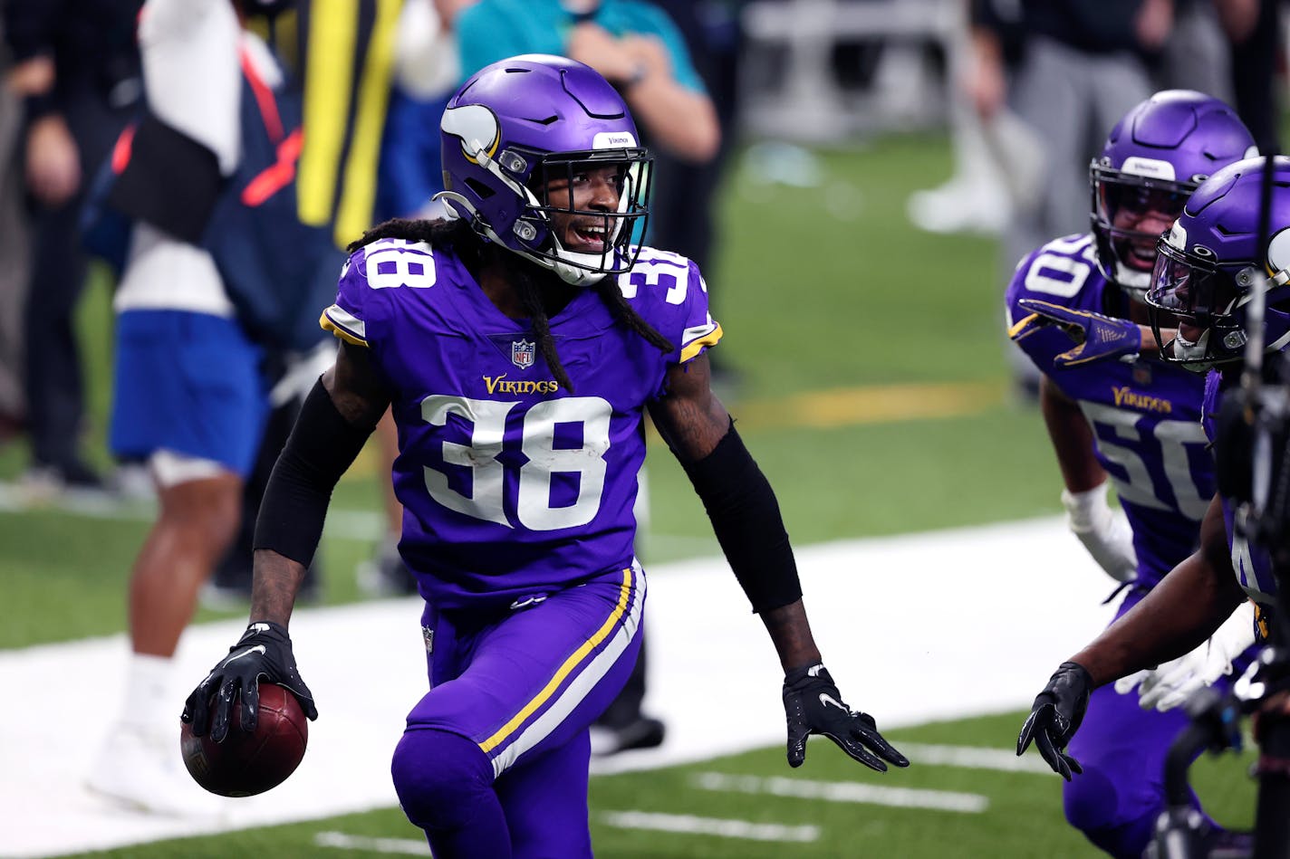 Minnesota Vikings cornerback Harrison Hand (38) celebrates his interception in the first half of an NFL football game against the New Orleans Saints in New Orleans, Friday, Dec. 25, 2020. (AP Photo/Butch Dill)