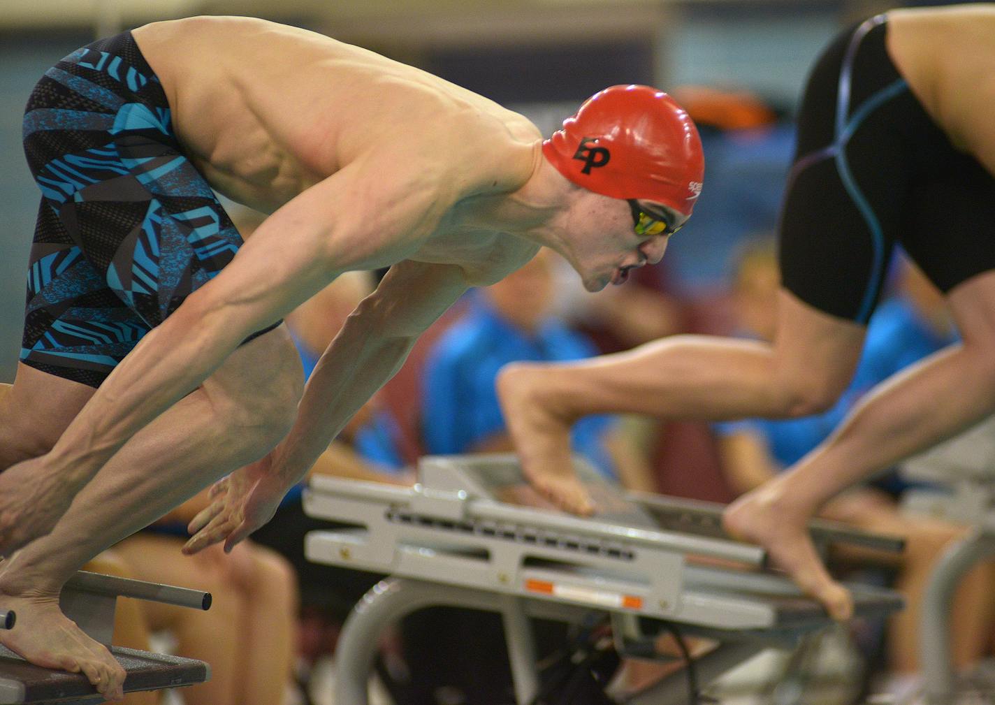 Eden Prairie junior Jordan Greenberg explodes off the starting block to begin the during the Class 2A boys' state swimming tournament preliminaries Friday night at the University of Minnesota's Aquatic Center. Greenberg's first place finish advances him to the championship round. ] (SPECIAL TO THE STAR TRIBUNE/BRE McGEE) **Jordan Greenberg (Eden Prairie, junior)