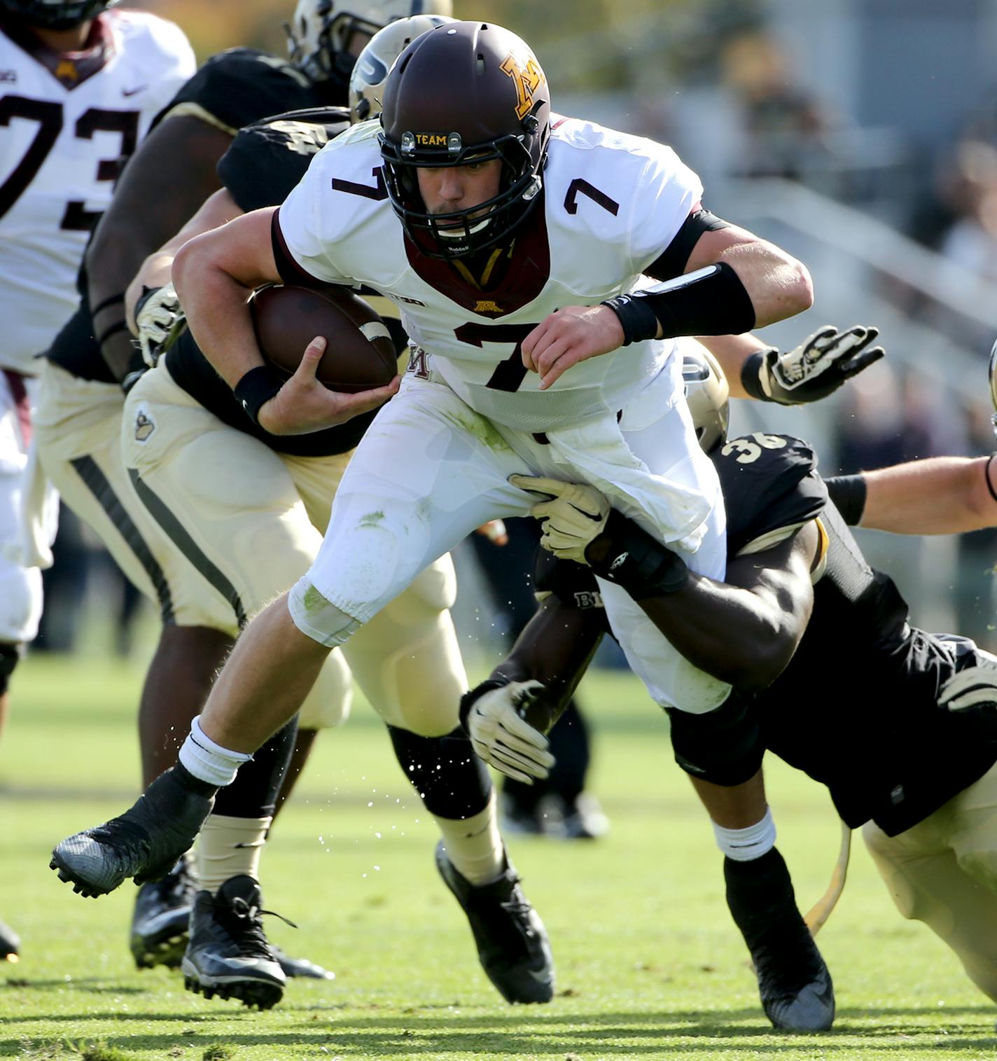 Minnesota Golden Gophers quarterback Mitch Leidner (7) was brought down by Purdue Boilermakers linebacker Danny Ezechukwu (36) during the first quarter. ] (LEILA NAVIDI/STAR TRIBUNE) leila.navidi@startribune.com Gophers vs Purdue at Ross-Ade Stadium in West Lafayette., Saturday October 10, 2015. ORG XMIT: MIN1510101538100480