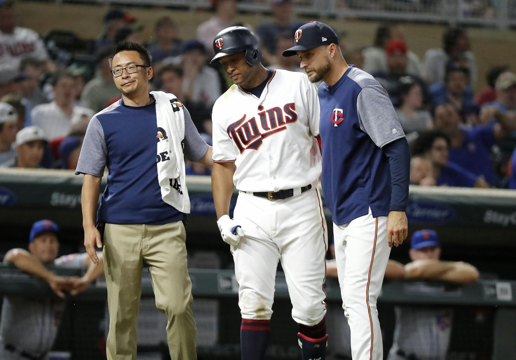 Minnesota Twins second baseman Jonathan Schoop (16) is pulled from the game for an injury while at bat in the ninth inning.