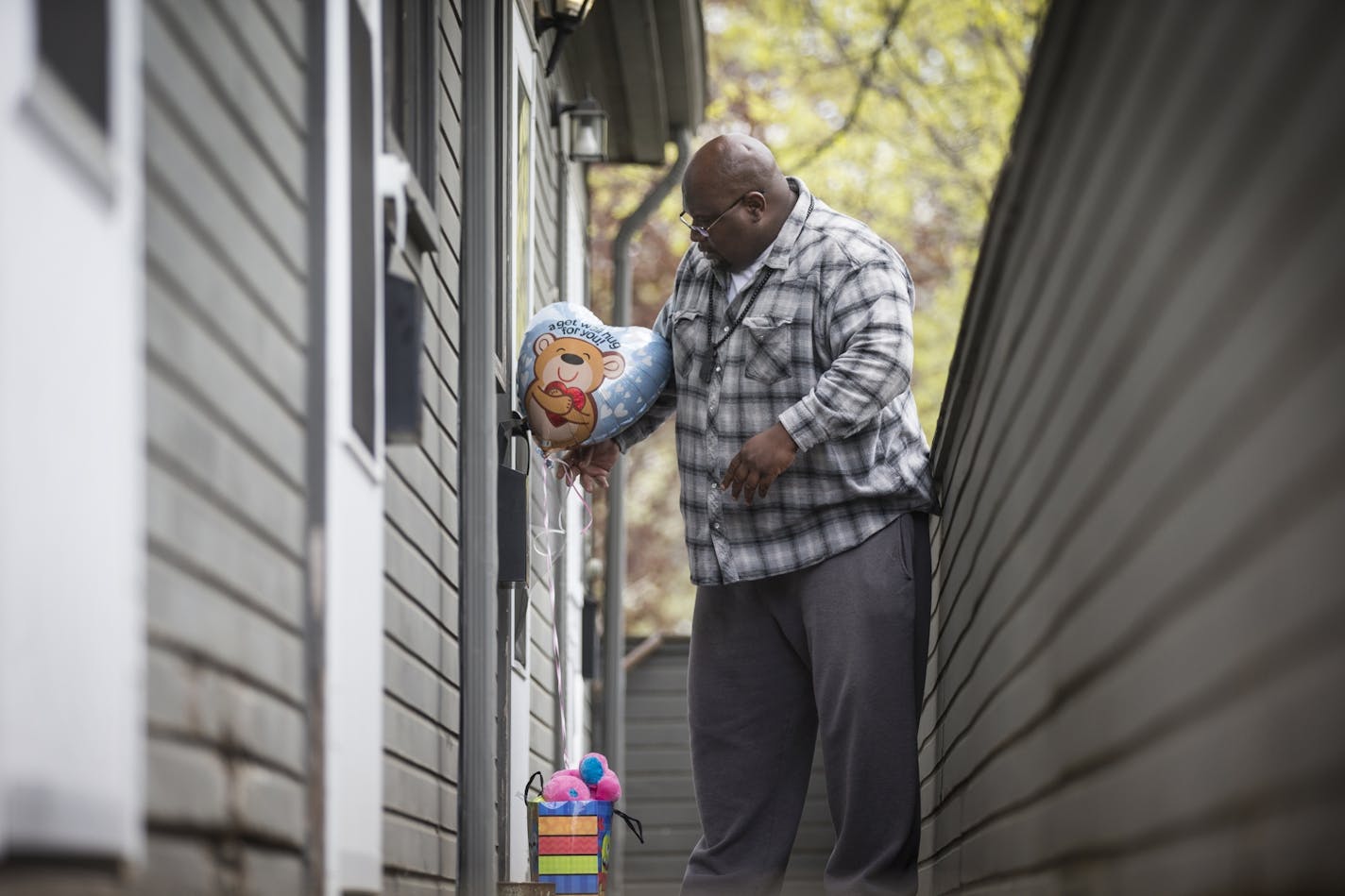 Jerry Knight, an acquaintance of the victim's grandmother, knocks on the door of her home to leave some gifts -- a balloon and a stuffed animal -- for the girl. "She's not my family, but she's part of the human family, " Knight said.