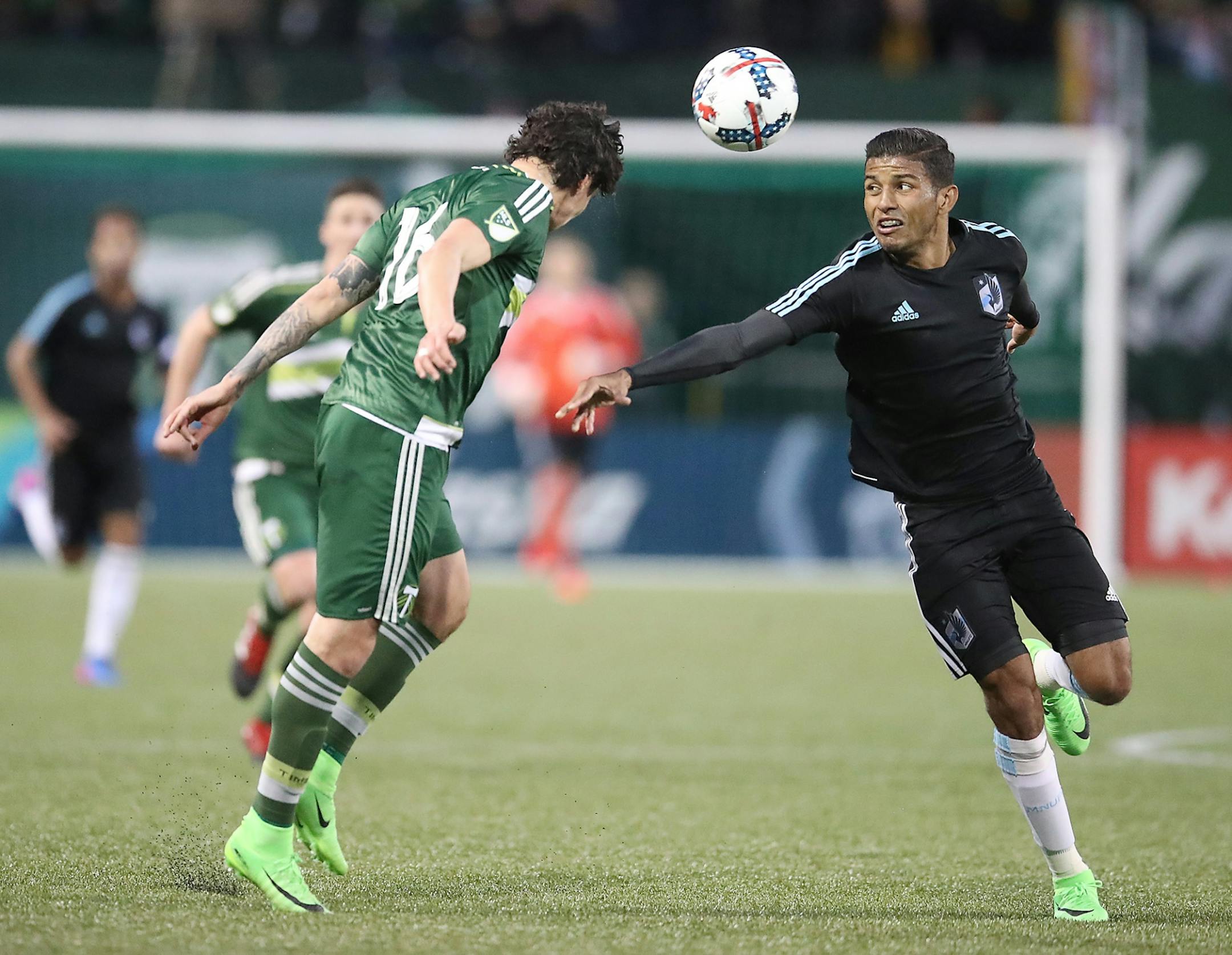 Minnesota United FC's Johan Venegas and Portland Timbers' Zarek Valentin battled for the ball in the first half.
