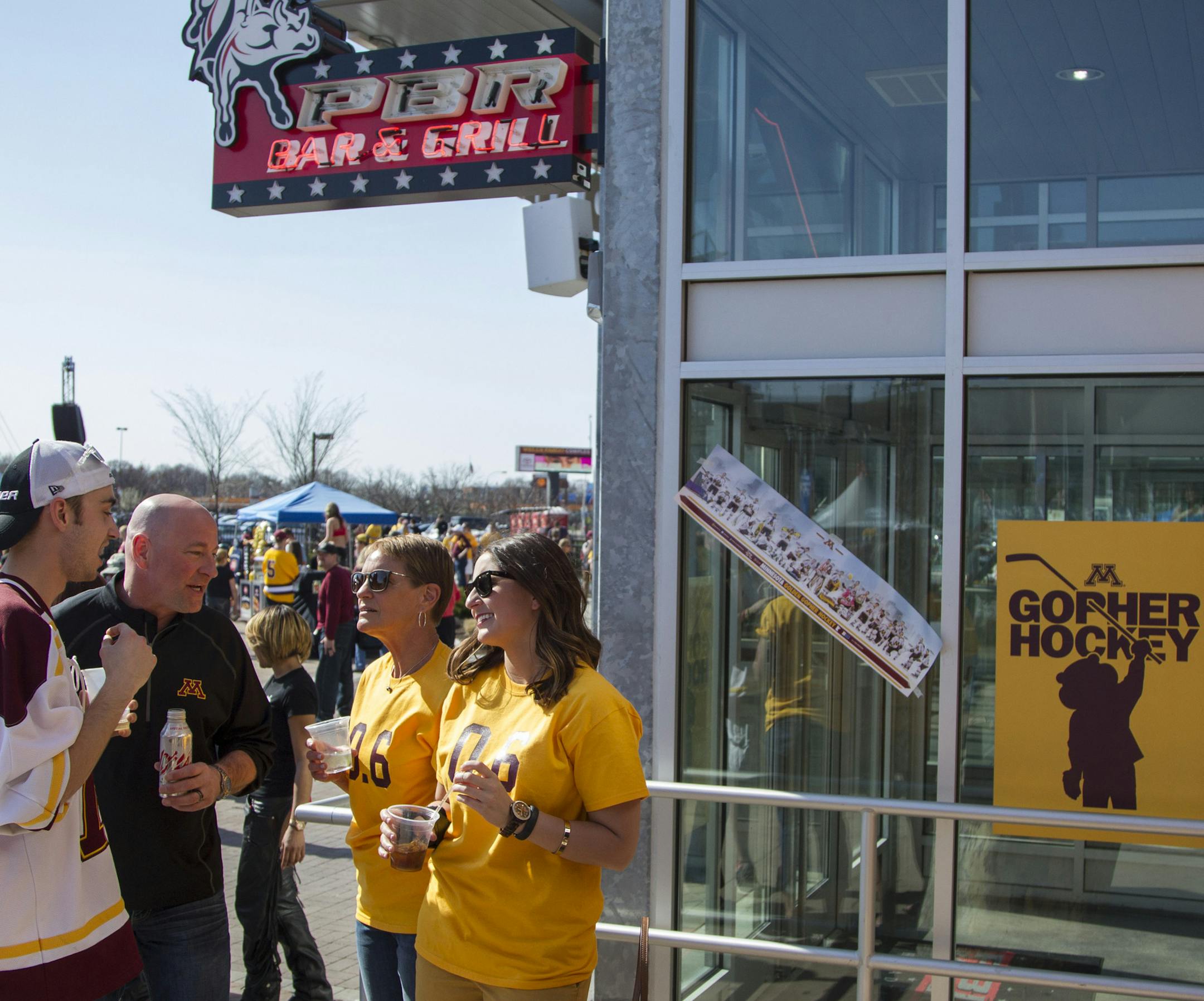 Minnesota fans take over the PBR Bar & Grill at Xfinity Live during the Frozen Fest of an NCAA men's college hockey Frozen Four tournament game, Saturday, April 12, 2014, in Philadelphia. (AP Photo/Chris Szagola)