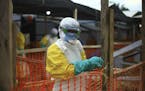 FILE - In this Tuesday April, 16, 2019 file photo, an Ebola health worker is seen at a treatment center in Beni, Eastern Congo.