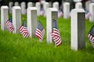 Around 3,000 volunteers placed around 50,000 flags at Fort Snelling cemetery on Memorial Day as part of Flags for Fort Snelling. ] GLEN STUBBE &#x2022