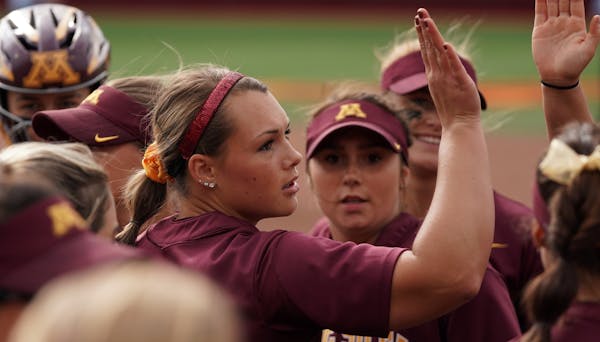 Gophers pitcher Amber Fiser (13) celebrated with her teammates after getting a third out. ] ANTHONY SOUFFLE &#x2022; anthony.souffle@startribune.com T