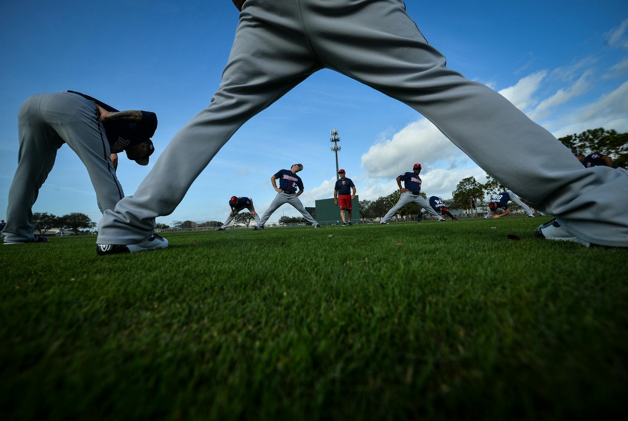 Minnesota Twins pitchers stretched at the start of their workout Thursday.