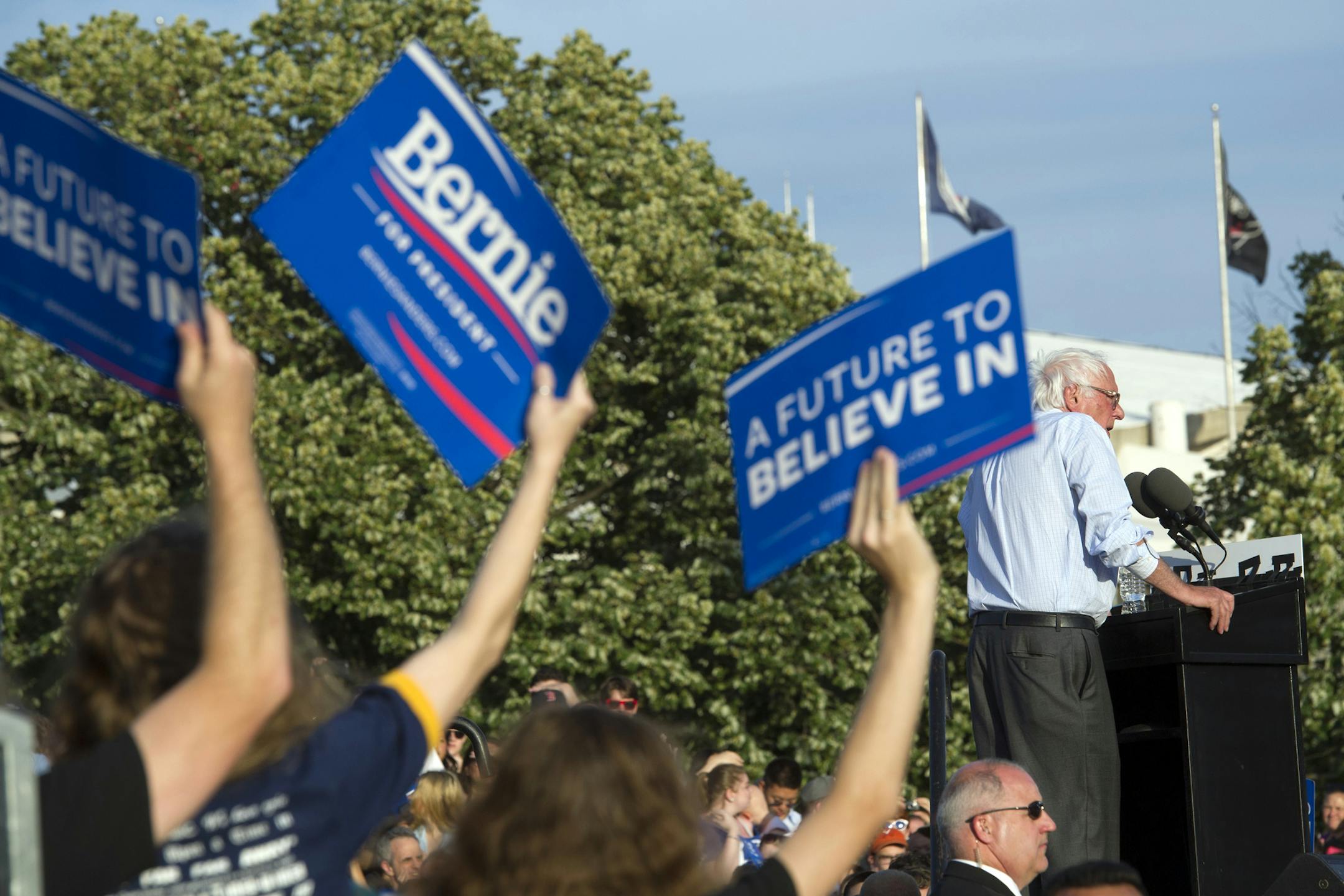 Supporters hold-up campaign signs as Democratic presidential candidate Sen. Bernie Sanders, I-Vt., speaks at a rally in Washington, Thursday, June 9, 2016. (AP Photo/Cliff Owen)