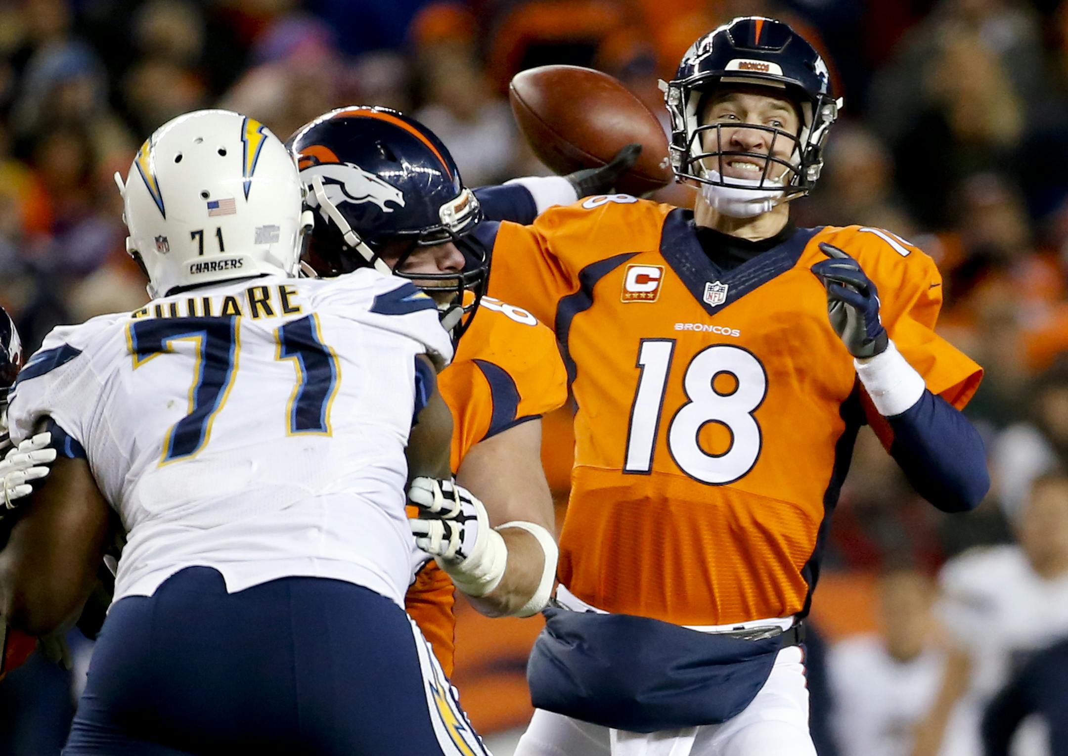 Denver Broncos quarterback Peyton Manning, right, passes against the San Diego Chargers during the second half in an NFL football game, Sunday, Jan. 3, 2016, in Denver. (AP Photo/Jack Dempsey)