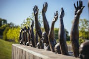 Raise Up, a sculpture by Hank Willis Thomas, on the grounds of the new National Memorial for Peace and Justice in Montgomery, Ala., April 20, 2018. De