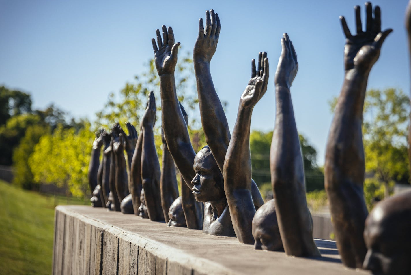 Raise Up, a sculpture by Hank Willis Thomas, on the grounds of the new National Memorial for Peace and Justice in Montgomery, Ala., April 20, 2018. Dedicated to the victims of American white supremacy, the site demands a reckoning with with the lynching of thousands of black people in a decades-long campaign of racist terror. (Audra Melton/The New York Times)