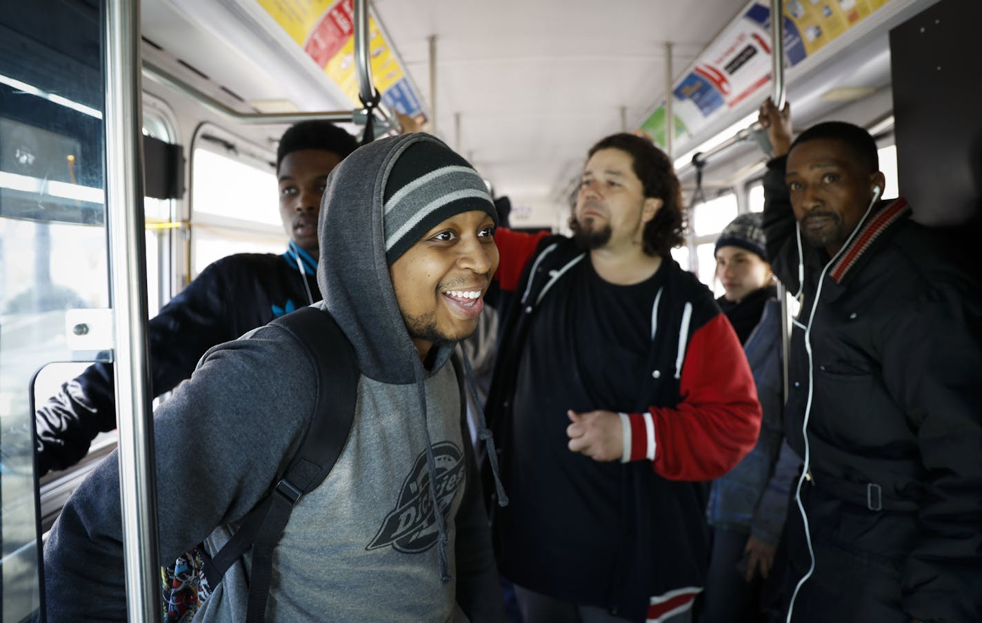 Austin Gay laughed as he realized the bus was full when he got on Bus 5 in downtown Minneapolis, Minn., on March 27, 2017. Route 5 goes from Brooklyn Center to the Mall of America through downtown Minneapolis, Minn. Gay says he uses the bus three times a week and the bus is always crowded. ] RENEE JONES SCHNEIDER &#x2022; renee.jones@startribune.com