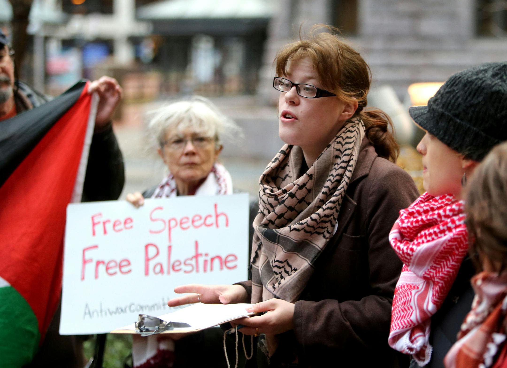 Two members of the Anti-War Committee, who were arrested during a lecture by Israeli Moshe Halbertal for disrupting his talk earlier in the month, appeared outside the Hennepin County Safety Building before an early morning court appearance Wednesday, Nov. 18, 2015. In a statement from AWC, they responded to critics, in part, saying "We are compelled to challenge Israel's policies of apartheid and occupation, and its defenders, at every turn." Among those speaking was Misty Rowan, an MCTC studen