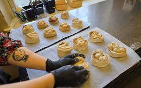 Sofia Uuksulainen makes korvapuusti at Kahvila Rakastan, the plant-based bakery and coffee shop in Helsinki she owns with her sister and mom.