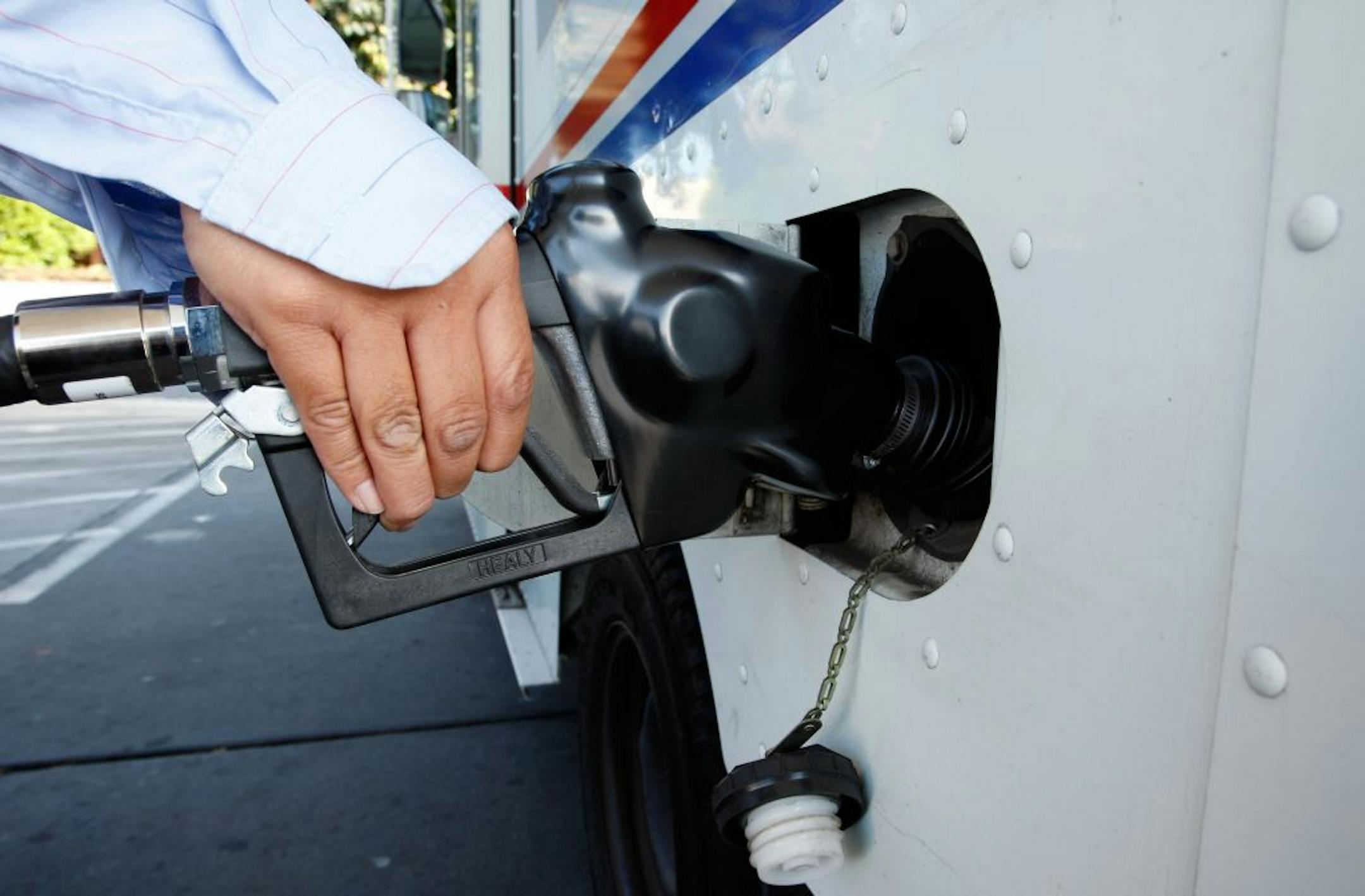 SAN FRANCISCO - NOVEMBER 06: A customer at a Union 76 station pumps gas into her truck November 6, 2007 in San Francisco, California. The national average for a gallon of regular gasoline increased two cents to $3.02 as oil futures surged today to a record high $96.70 a barrel.