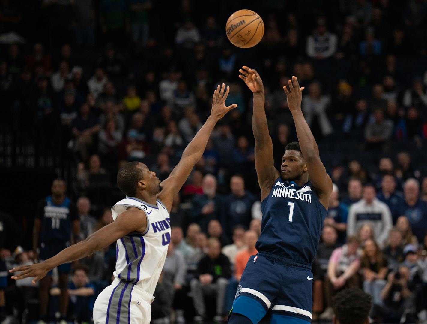 Minnesota Timberwolves guard Anthony Edwards (1) put up three of his game high 33 points in the fourth quarter over Sacramento Kings forward Harrison Barnes (40). The Minnesota Timberwolves lost 118-111 in overtime to the Sacramento Kings in an NBA basketball game Monday night, January 30, 2023 at Target Center in Minneapolis. ] JEFF WHEELER • jeff.wheeler@startribune.com