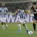 Monterrey's Jonathan Gonzalez, left, and Al-Sadd's Baghdad Bounedjah run or the ball during the Club World Cup soccer match between Monterrey and Al-S