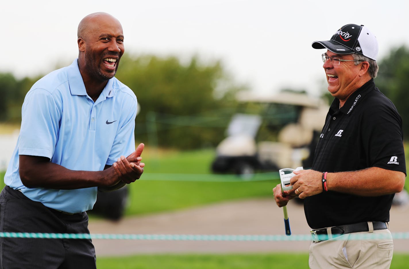 Two-time defending champion Kenny Perry (right, with ESPN basketball analyst Bruce Bowen) is trying to play more with his grandkids as well as play golf.