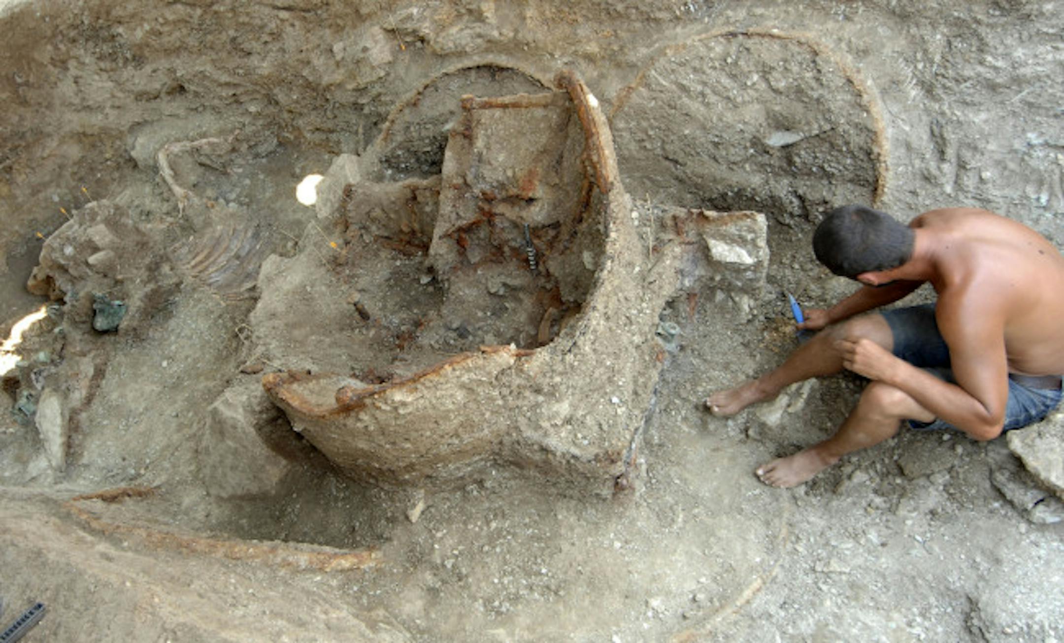 An archaeologist worked Thursday on the slow job of uncovering a 1,900-year-old chariot at a Thracian tomb near the Bulgarian village of Borisovo. It is the first chariot from the period to be found intact in Bulgaria, an expert said.
