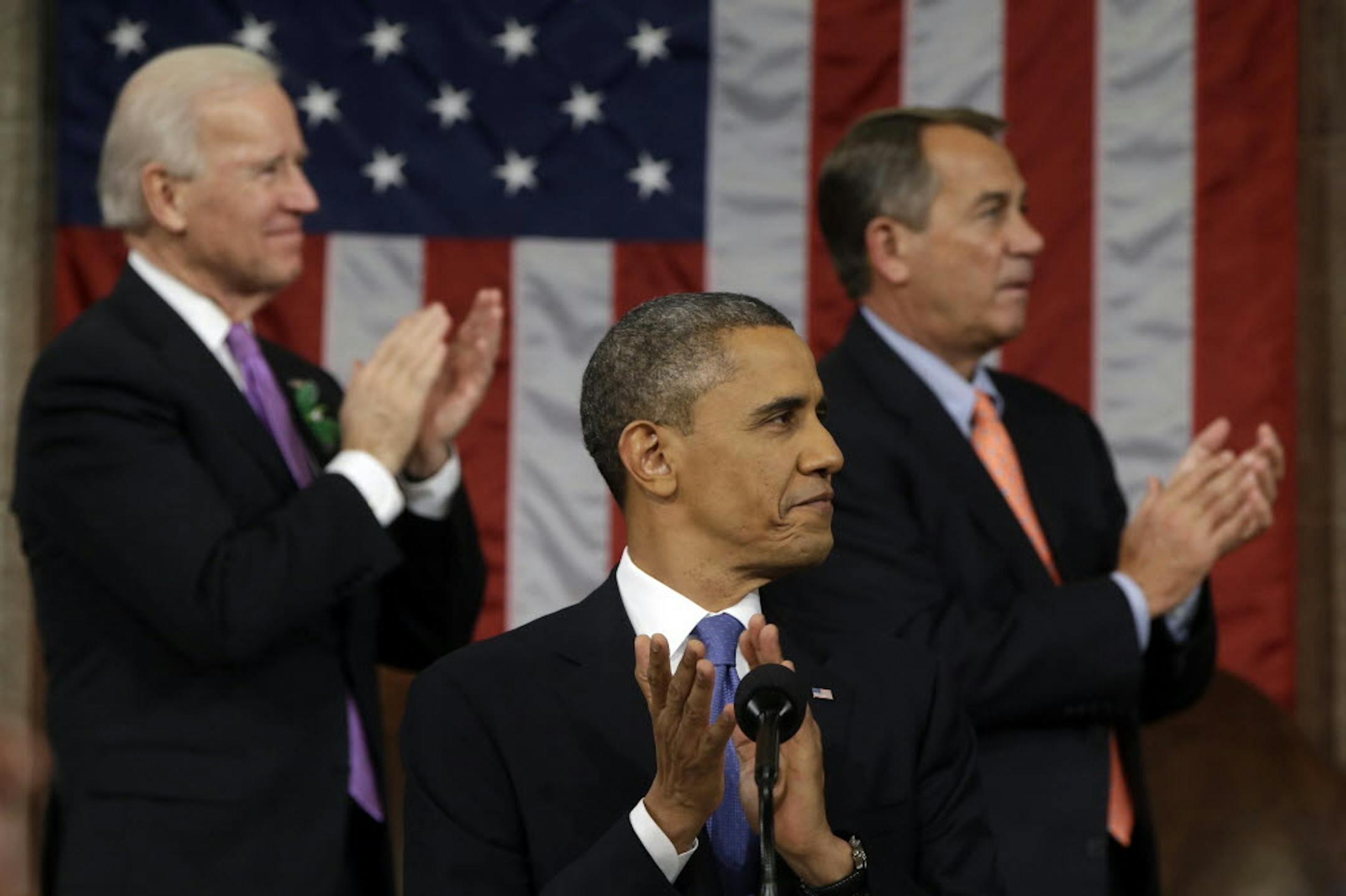 President Barack Obama, Vice President Joe Biden and House Speaker John Boehner of Ohio applaud during the president's State of the Union address.